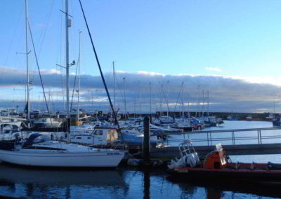 View across boats moored in the marina.