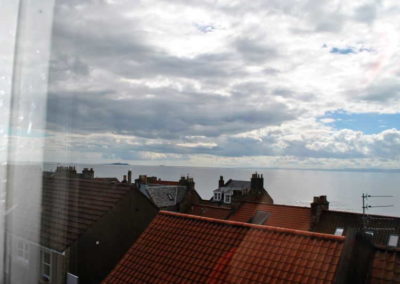 Views over the rooftops from the attic show the proximity to the sea