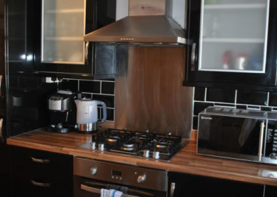 Electric oven and gas hob, microwave, kettle and coffee maker.