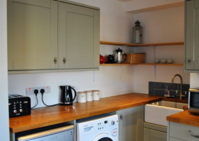 Modern kitchen with a washing machine and dishwasher gives you everything you need for a comfortable stay.