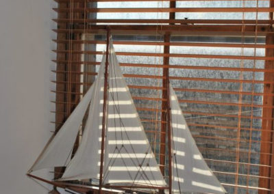 Model of a sailing ship on a window ledge