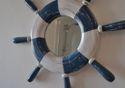 Bathroom mirror in the shape of a ship's wheel
