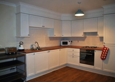 White wooden-fronted kitchen cabinets