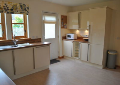 The kitchen offers access onto the enclosed garden