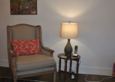 Arm chair with small table and lamp