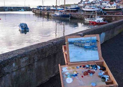 Artist's painting in front of the harbour
