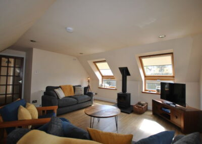 Spacious, light lounge with Velux windows