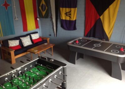 Table football and air hockey. Flags on walls.