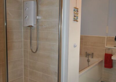 Separate shower within the family bathroom