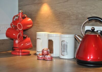 Red mugs and kettle