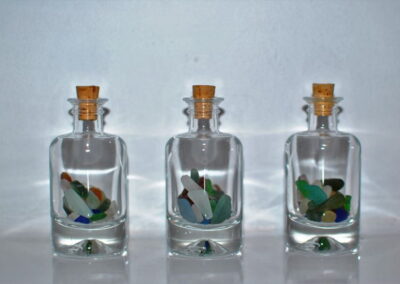 Three jars of sea glass