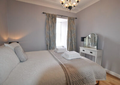 Double bedroom with harbour views and en suite shower