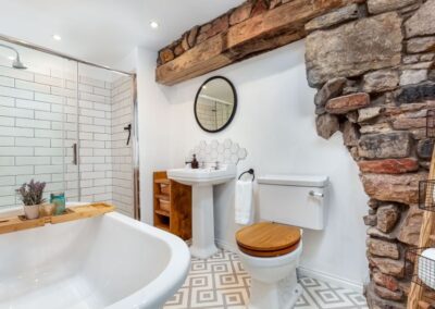 The indulgent bathroom has a free-standing bath and separate shower.
