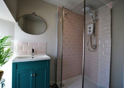The modern shower room has a walk in shower
