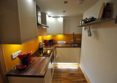 The kitchen is centrally positioned in the apartment