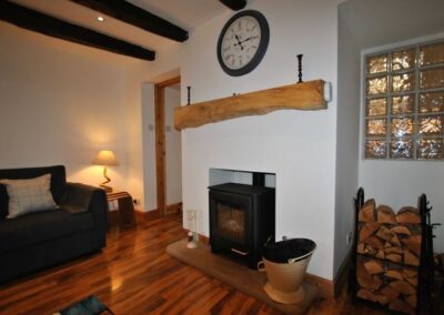 The wood burning stove is a focal point of the room