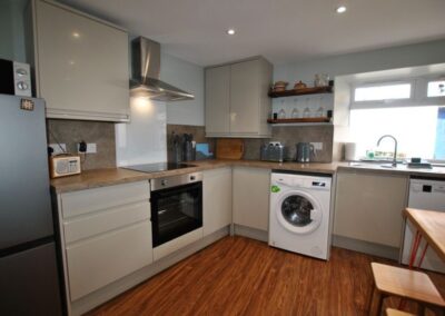 The kitchen has everything needed for a self-catering stay including a washing machine and dishwasher