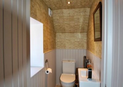 The downstairs WC is located by the rear entrance, ideal if spending time in the garden
