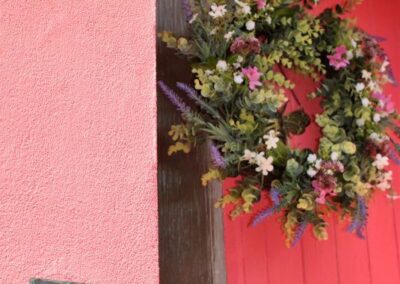 Wreath on deep pink front door