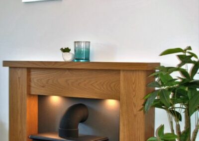 Wooden fireplace above a stove
