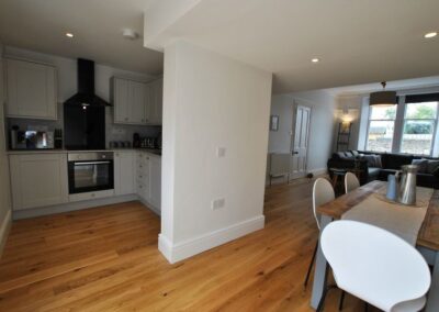 Kitchen, dining room and living room in large open plan space