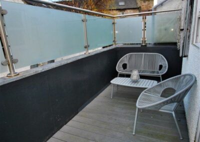 Enjoy a seat on the private balcony