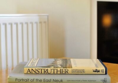 Two books on a table: Anstruther and Portrait of the East Neuk.