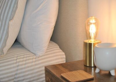 Unique bedside table lamp is a large bulb.
