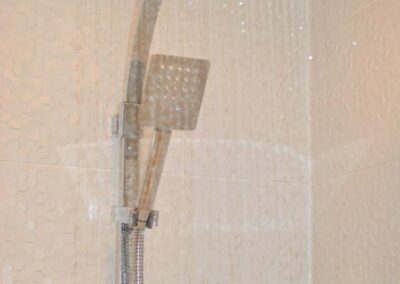 Close up of a rectangular rainfall shower head.