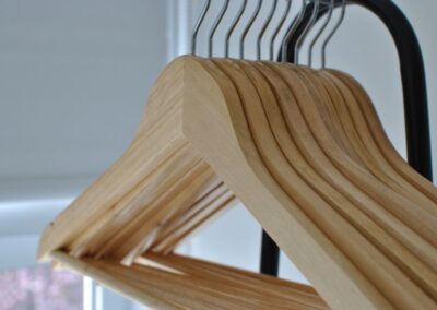 Close up of wooden coat hangers.
