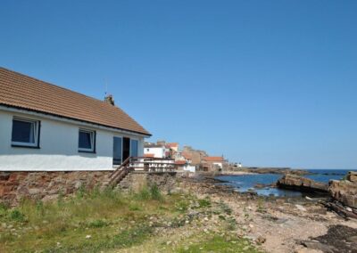 View from stone beach towards house.