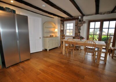 Large kitchen with double-door chrome fridge.