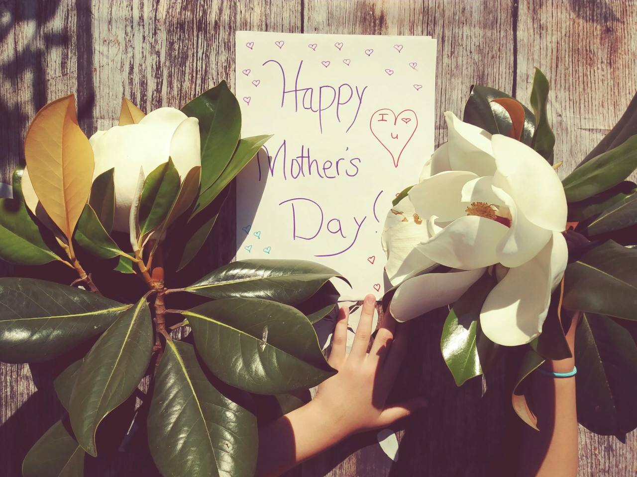 Sign reads Happy Mother's Day surrounded with flowers