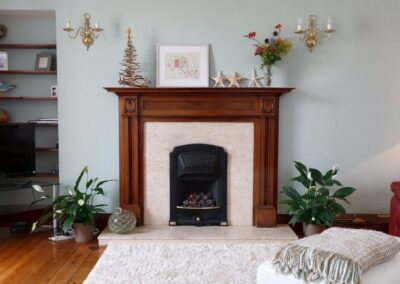 Gas fire in traditional fireplace.