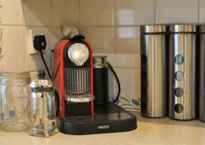 Close-up of Krups coffee machine in the corner of the kitchen.