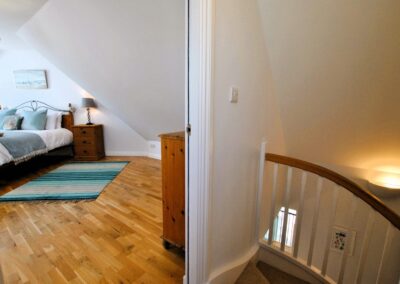 View into double bedroom from top of stairs.