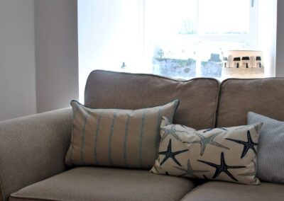 Starfish cushion on sofa.