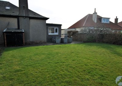 Enclosed garden with plenty of grass.