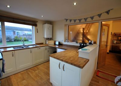View from kitchen through door towards lounge.
