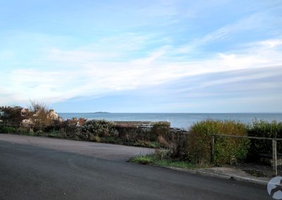 View across road towards the sea and the Isle of May beyond.