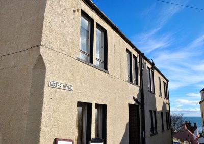 Terraced house with road sign Water Wynd.