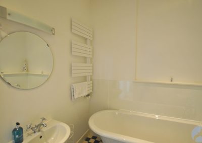 White bath against a white wall.