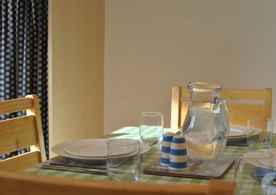 Table set with crockery and glasses.